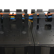 Close-up of a network cable management system with colored cables.